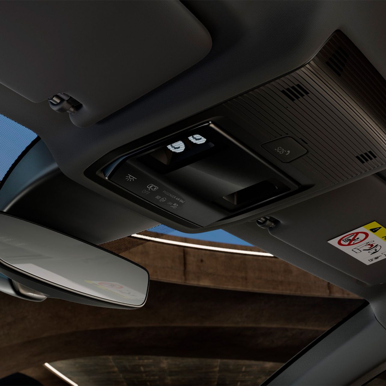 Vista interior do novo cupra leon sportstourer mostrando a consola superior com um espelho retrovisor e luzes LED do habitáculo.